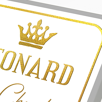 Gold foil label showing a crown and writing.