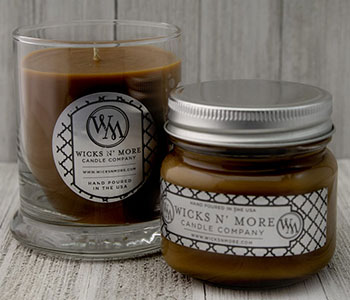 Two candle jars with metal lids and white labels that read "Wicks N' More".