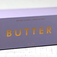 Purple copper foil that reads "Butter" in a golden color.