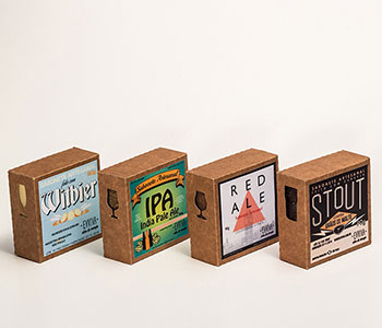 Four square packages of soap in paperboard with different designs.