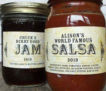 Glass jars with metal lid and white label that read "Jam" and "Salsa".