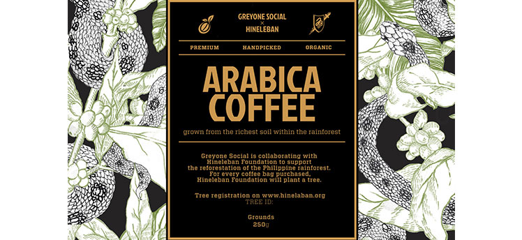 Black label that reads "Arabica Coffee" on a black and white box with a tree and a snake.