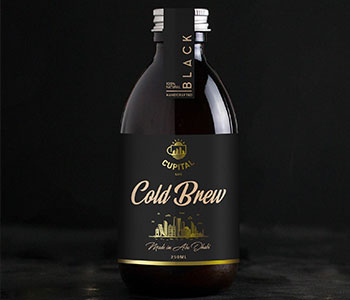 Black container with black label that reads "Cold Brew".