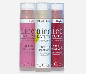 Three chapsticks labels and containers that read "Juice Beauty".