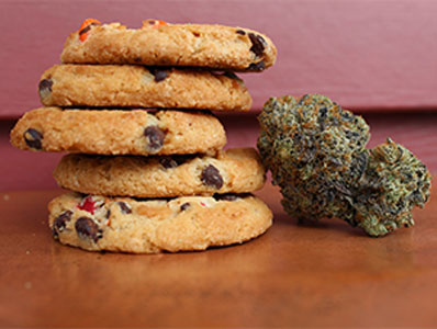Cookies stacked one on top of the other and a marijuana nugget.