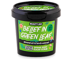 A black, plastic container with a green label that reads "Belief in green leaf".