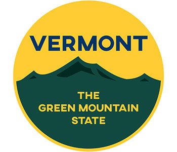 A yellow and green round label that reads "Vermont The Green Mountain State".