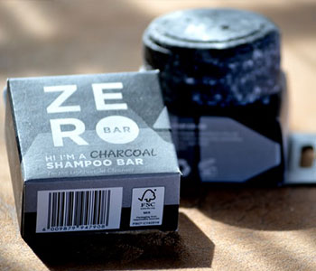 Black, square package of soap that reads "ZERO".