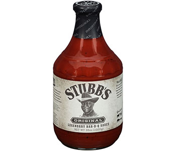 Glass bottle neck containing barbeque sauce with a label that displays a man and says "Stubb's".