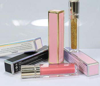 Rectangular containers for pink lip glosses.