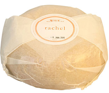 A roll of cheese wrapped in paper with a label that reads "Rachel".
