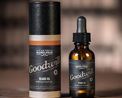 Two black bottles of beard oil with a dark label that reads "Goodwill".