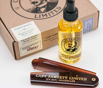 A brown razor that reads "Captain Fawcett Limited" and a yellow container of beard oil.