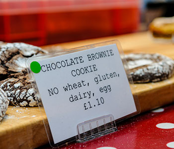 "Chocolate Brownie Cookie No wheat, gluten, dairy, egg" sign in front of the product.