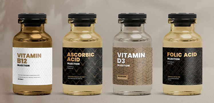 Four glass vitamin containers with different label designs.