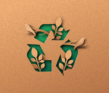A piece of cardboard designed with the recycling logo.