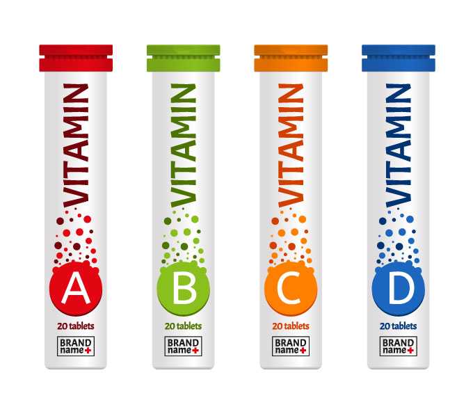 四種不同的容器，分別裝有維生素 A、B、C 和 D，每種容器都有其特定的顏色。