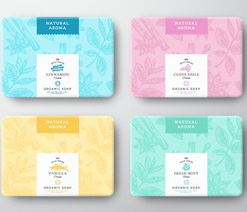 Four colorful packages of soap bar with leaves design.