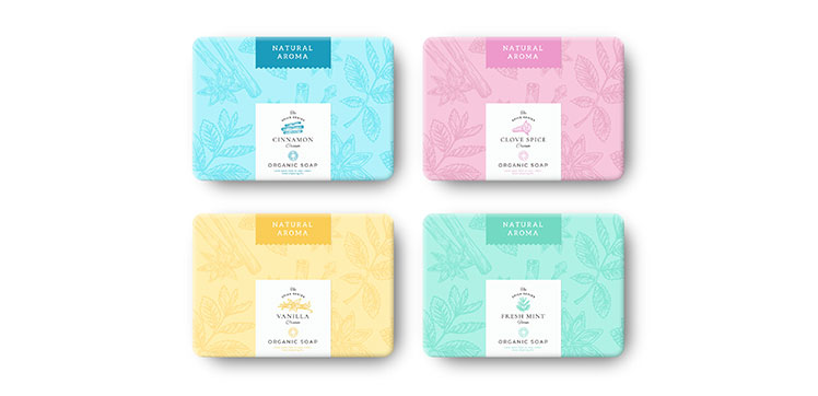Four packages of soap in different colors and aromas.