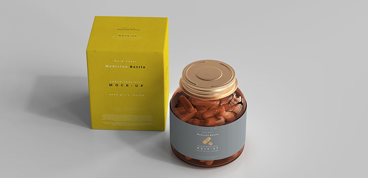 A yellow box and a glass jar with metallic lid and gray label that contains vitamins.