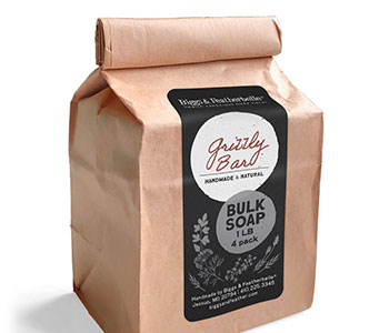 A paper bag with a black label that reads "Grizzly bar Bulk Soap".